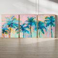 A vivid acrylic painting depicting a row of palm trees with lush foliage in various shades of blue and green, set against a soft pastel pink and orange sky.